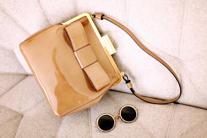 Orla Kiely bag, miu miu sunglasses